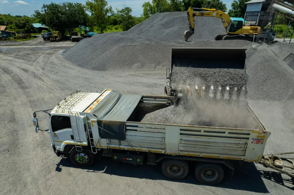 Landscape gravel delivery truck supplying gravel materials for residential landscaping projects in Alberta