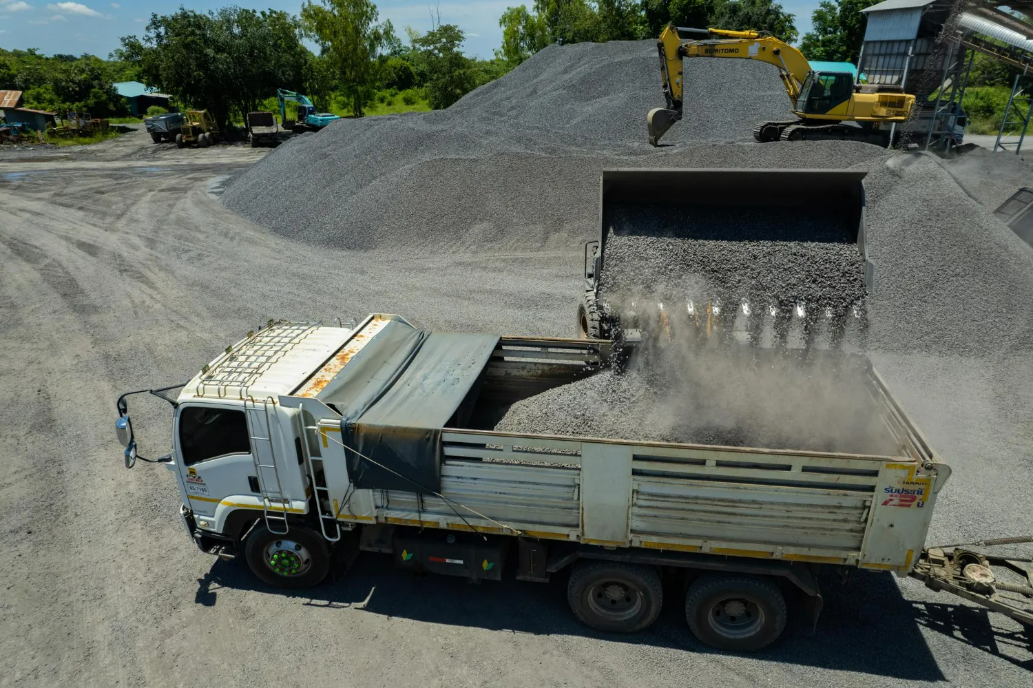 Landscape gravel delivery truck supplying gravel materials for residential landscaping projects in Alberta